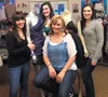 C’est La Vie Affordable Fashions owner Caroline Henn, center, with her crew inside the Wasilla store. Henn is celebrating one year in the retail clothing business. Courtesy Caroline Henn