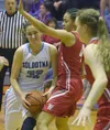 Soldotna's Danica Schmidt drives on Wasilla's Olivia Davies on Thursday, Feb. 15, 2018, at Soldotna High School. Photo by Jeff Helminiak/Peninsula Clarion