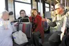 Sen. Lisa Murkowski visits with Wasilla residents Rosemary Vavrin and Patrick Brown and other Valley folks while riding a Valley People Mover bus during a visit to the Mat-Su Borough last wee