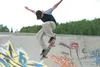 Wasilla's skate park has been busy with local youth practicing
their skills for the upcoming Alaska State Fair X-Jam. Above,
Tanner Comoza, 15, performs a stunt, while others look on, at left
