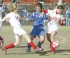 (ROBERT DeBERRY/Frontiersman) Wasilla Warriors Becca Newcomb,
left, and Tabor Tingstad take control of the ball from Palmer Moose
Shea Riggs during Monday's game at Wasilla High School.
