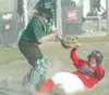 ROBERT DeBERRY/Frontiersman A Juneau-Douglas Crimson Bear slides
under Colony catcher Kelsey Stein during the 2008 season. Despite
losing seven players from the 2008 squad, CHS head coach Mik