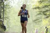 Palmer freshman Sophie Wright reaches the top of the hill during the Palmer Invitational earlier this season. Wright and the Moose will run in the Region III Championships Saturday at the Gov