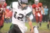 ROBERT DeBERRY/Frontiersman Colony senior Collin Murphy runs the
ball on a quarterback keeper during Friday’s 53-24 win over the
Wasilla Warriors. Murphy ran for 272 yards in the game.