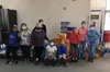 United Way volunteers pose for a photo after sorting and filling snack sacks. Courtesy photo.