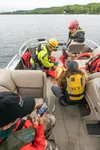 On the boat taking back a 'victim' during a recent West Lakes Fire Department  water rescue drill are, top to bottom, Teri Petram, DJ Ramey, Jamie Bliss, and JoeHanna Heath J. David McChesney