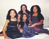 Gabriella "Gabby" Matthews, center, smiles for a family portrait with her mother April and her two sisters. A fundraiser is planned Saturday to help the family travel to the Seattle Children'