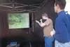 ROBERT DeBERRY/Frontiersman Tim Thomas, Alaska Department of
Fish and Game’s Southcentral coordinator for hunter education,
takes aim at the Laser Shot screen while Fish and Game’s Jerry
Souk