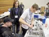 John Williams, Dylan Rouska and Conner Floyd — team 5350 Phoenix from Burchell High School — work in the pits during the state robotics tournament in Fairbanks. Courtesy photo