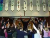 Vince Ambrosetti and the children of St. Michael's perform "Big
Steps, Little Feet" during the Sunday concert. Ambrosetti
encourages active participation from his audience, both in singing
an
