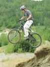 ROBERT DeBERRY/Frontiersman A mountain biker takes a jump over a
mound of dirt. The Mat-Su Valley offers tremendous opportunity for
those interested in hitting the trails on their mountain bi