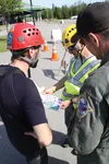 Members of the Alaska Incident Response Team consult with a state Department of Public Safety pilot during a simulated  in Palmer. BRIAN O’CONNOR/Frontiersman