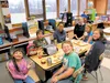 Teacher Mary Donalson hosts a buddy lunch Oct. 5 in her third- through fifth-grade classroom at Glacier View School. Seated around the table are second-grader Charish Allen, seventh-grader Be