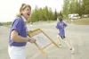 ROBERT DeBERRY/Frontiersman Linda Jo Klapperich plays the
washboard and cheers on runners near the finish line of the Curtis
C. Menard Memorial Run. Klapperich was recently named the Mat-Su
B