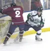 Alaska forward Connor Wright, right, tries to poke the puck free
against Fairbanks last year. Wright was first acquired in the
2010-2011 season in a trade with Kenai River. ROBERT
DEBERRY/Fro