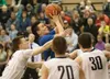 Palmer High senior Adam Ramoth, seen here knocking down a shot against Soldotna, has committed to Edmonds Community College in Lynwood, Wash. Frontiersman.com