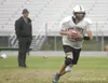ROBERT DeBERRY/Frontiersman Colony quarterback Rob Lorentz
scrambles to the right on a quarterback keeper during Thursday’s
practice as head coach Brian McIntosh watches. Robert DeBerry