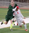 Colony's Jake Forstner and Wasilla's Tim Voloshin battle for possesion during a 1-1 tie at Wasilla High School April 14. JEREMIAH BARTZ/Frontiersman