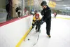 Coach Jeff Woolcott works on defensive skills with camp participants Thursday at the Summer Elite Hockey Camp at the Brett Memorial Ice Arena in Wasilla. ROBERT DeBERRY/Frontiersman.com