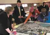 A group from Wasilla identifies routes and destinations to make the city more walkable at a Palmer Depot presentation last week. BARBARA HUNT/For the Frontiersman