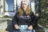 Dawn Syers sits on the steps in front of her home holding a
picture of her fiance Dale Prater. Prater, who turned 45 in August,
was gunned down Saturday night at a neighbor's home inside the
