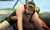 Houston senior Dylan Jackson works to pin West Anchorage's Poe Vaafuti during the 285-poound final of the Lancer Smith Memorial Saturday at the Menard Sports Center in Wasilla. Jeremiah Bartz