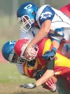 ERIC ENGMAN/Fairbanks Daily News-Miner West Valley’s Cody
Hockenberry is face-masked by Palmer’s Brandon Wisner while
returning the game-opening kick-off of a game between the Moose and
the W