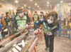 Colony Cross Country Ski team members Ellen VanGorder, left and
Abby Jahn work on the base of their skis Thursday before the start
of the Alaska State Cross Country Ski Championships at Kinca