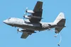 U.S. Army paratroopers assigned to the 4th Infantry Brigade Combat Team (Airborne), 25th Infantry Division, U.S. Army Alaska, jump from an Illinois Air National Guard C-130 Hercules while con