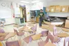 Mark Nelson changes trash can liners at Palmer High School on
the last day of school in 2009. An arbitration decision released
today states the Mat-Su Borough School District should not be
fo
