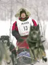 Mike Suprenant moves his team off Knik Lake and into the woods
during the start of the 2008 Joe Redington Sr. Memorial Knik 200
Sled Dog Race. This year's race starts at 11 a.m. Saturday on K