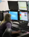 Dispatcher Salley Beach checks a computer-assisted dispatch screen Tuesday, Dec. 22 at the Palmer Dispatch Center. Officials in the Mat-Su borough are considering changes to the way dispatch 
