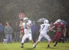 Colony quarterback Robert Lorentz looks for an open receiver under a curtain of rain during the second half of Friday’s game against the Wasilla Warriors at Veterans Memorial Field at Wasilla