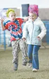 ROBERT DeBERRY/Frontiersman Rudy Bostwick, 8, left, and cousin
Kellcee Collins, 9, compete in the three-legged race during the 4-H
Fun Day on Monday, the last day of the Alaska State Fair in
