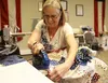 Quilts of Valor quilter Marion Dunn sews some swatches together at the Wasilla VFW on Friday. The Forget Me Not Quilters of the Alaska chapter sewed dozens of quilts this week, in between pre