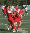 Colony's Ben Sande tries to force the ball through a trio of Wasilla Warriros during a 3-0 win May 16 at Colony High School. Jeremiah Bartz