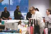 Volunteers stuff “goodie bags” full of snacks, tools, hygiene products and gift cards at a meeting last week for Project Homeless Connect in the Curtis D. Menard Memorial Sports Center. The e