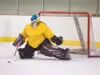 ROBERT DeBERRY/Frontiersman Mat-Su Ravens goalie Tessa
Muilenburg blocks a shot during a recent practice at the Brett
Memorial Ice Arena in Wasilla.