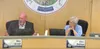 MSB Manager Mike Brown and MSB Mayor Edna DeVries listen and discuss the proposed $ 0.07/gallon gas tax during the Aug 5 Assembly meeting. The tax has been met with overwhelming disapproval f