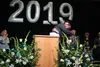 Valley Pathways teacher Robert Hassen hugs valedictorian Caitlin Nelson during the school’s graduation ceremony Wednesday. Photos by Jacob Mann/Frontiersman/