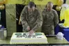 Brig. Gen. Clint Walker, commanding general of 184th Sustainment Command, cuts a cake in honor of the last year's Army birthday at Camp Arijan, Kuwait, June 14, 2019. This month, the Army wil