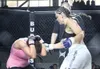 Keith Darkchilde/Alaska Fighting Championship Wasilla’s Kloiah
“Crazy Mama” Wayland defends herself against blows coming from
Anchorage’s Lauren Taylor at Wednesday’s Alaska Fighting
Champion