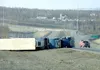 Three tractor-trailers were blown onto their sides Thursday near
the intersection of the Parks and Glenn highways. Photo by WILLIAM
WOODY/Frontiersman.