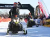 Tyler Aklestad, left, and Tyson Johnson cross the finish line to win the Iron Dog behind the Morris Thompson Center on Saturday, February 27, 2016. The Iron Dog is an approximately 2,000-mile