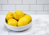 Lemons may look bright and sunny on your kitchen countertop, but they'll stay fresher longer inside a bag in the refrigerator.