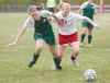 Colony freshman Ashley James and Wasilla junior Lina Shadrach
collide with each other while going for the ball during Wasilla's
win over Colony Monday afternoon at Wasilla High School. Wasill