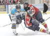 Alaska Avalanche Kristian Duziubinski takes down two Fairbanks
Ice Dogs during Friday’s game at the Wasilla Multi Use Sports
Complex. ROBERT DeBERRY/ Frontiersman