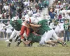 ROBERT DeBERRY/Frontiersman A pack of Colony defenders tries to
stop Wasilla’s Devon Teeling from gaining any more yardage during
Wasilla’s 42-7 win Friday at Colony High School. Robert DeBer
