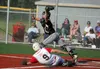 Palmer catcher Skyler Hale catches a high throw to get the force at home as Wasilla's Jimmy Arend slides in during the Pioneers 10-0 loss to the Road Warriors July 3, 2018, at Wasilla High Sc