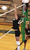 Colony freshman Amanda Deml jumps to block a Juneau hit in the
second game. Deml was called up during the season and has helped
solidify Colony's front line. Photo by TIM BRODT/Frontiersman/